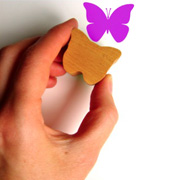 A homemade rubber stamp in the shape of a butterfly